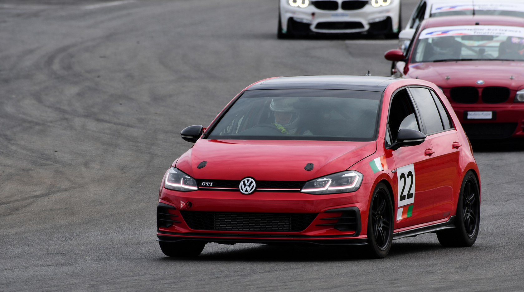 Red #22 Golf GTI race car in action with clean bonnet