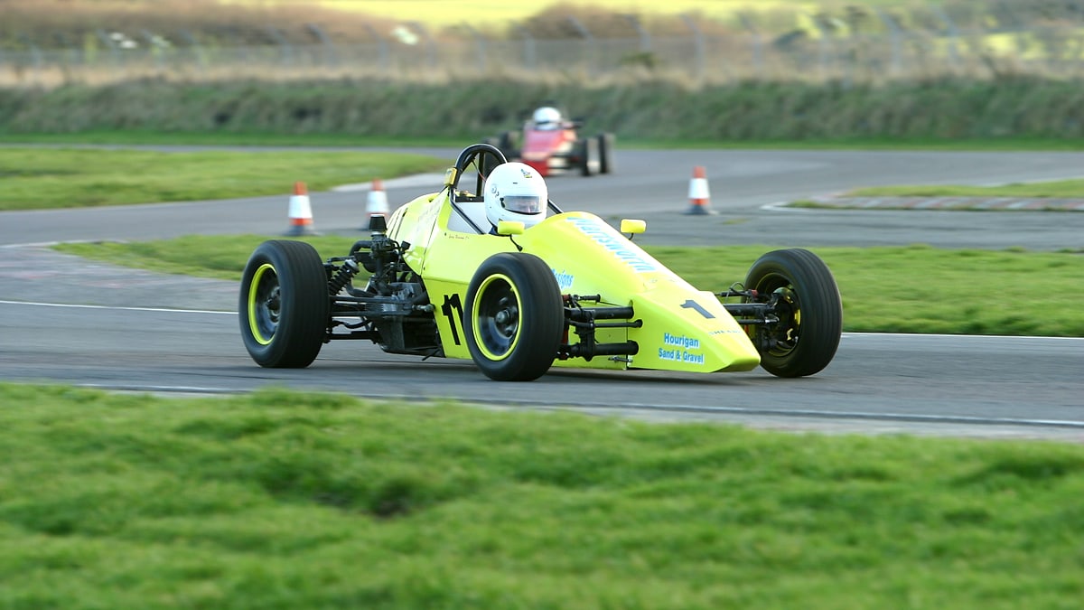Yellow Irish Formula Vee race car in a pack